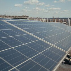 Medium Shot Of Solar Panels On Flat Roof SBI  Scaled