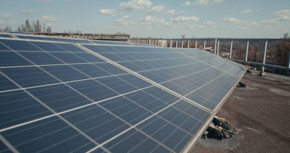 Medium Shot Of Solar Panels On Flat Roof SBI  Scaled